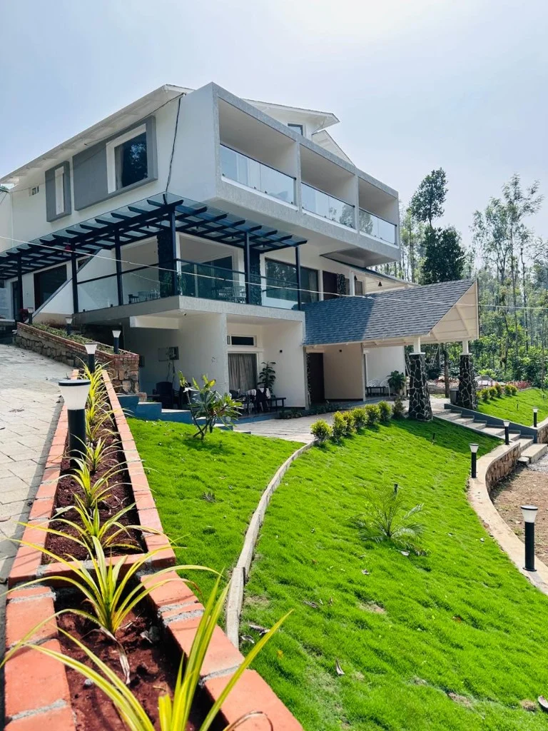 Homestay P3 exterior with glass balcony terraces and landscaped lawn