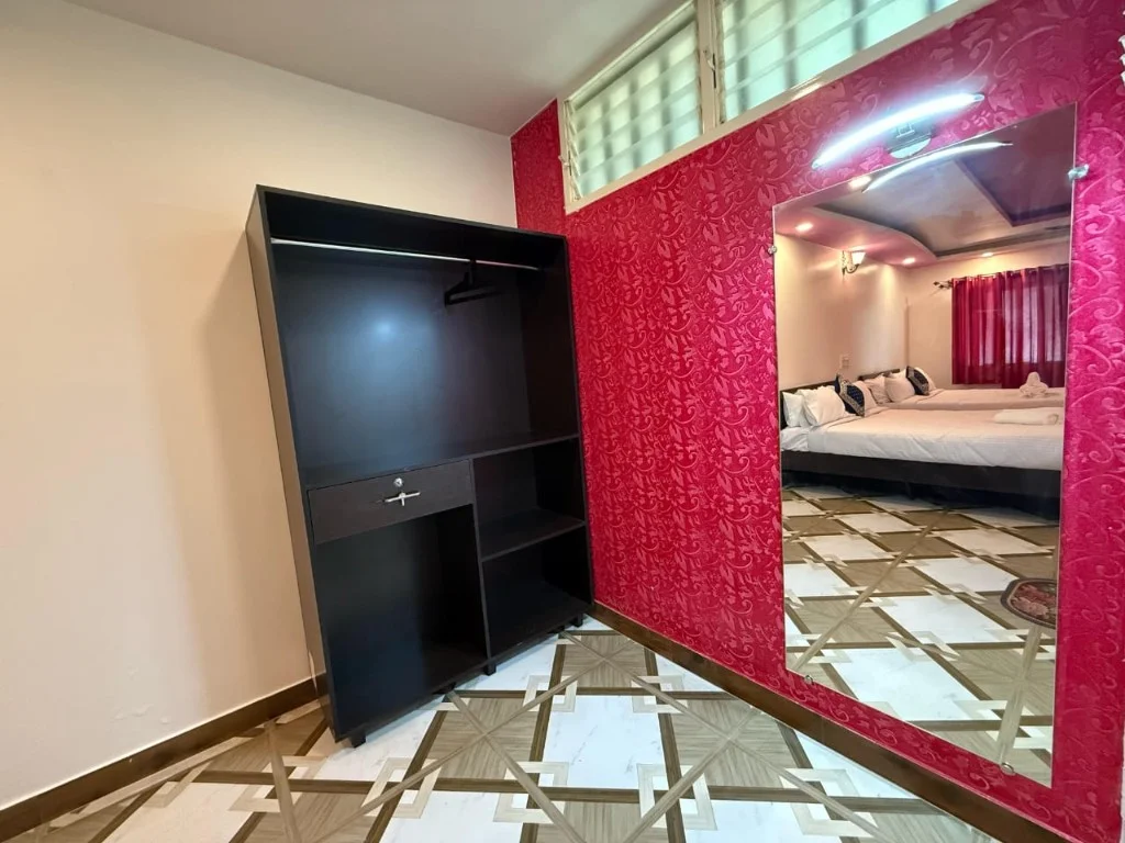 In-room wardrobe with full-length mirror at Trip Chikmagalur Resort P2