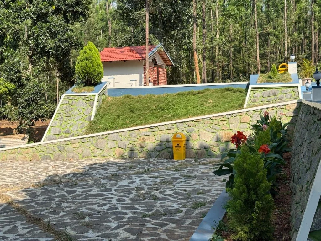 Scenic stone terraces and cottage surrounded by forest at Trip Chikmagalur Resort P2